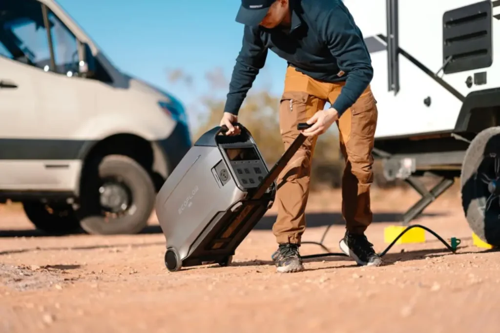 EcoFlow DELTA Pro 3 portable power station beside a van and camper trailer for van life off-grid power setup