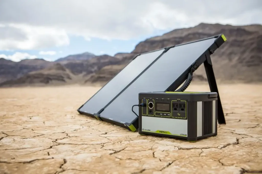 Goal Zero Boulder 100 Briefcase solar panel with Goal Zero Yeti power station set up in a desert landscape for van life and off-grid camping.